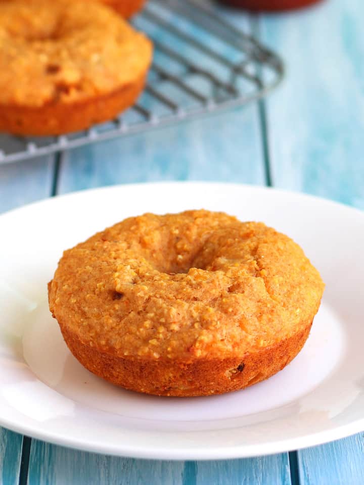 Cheddar Sriracha Cornbread Donuts. A flavorful blend of hearty cornmeal, whole wheat flour, spicy sriracha sauce and cheddar cheese. Perfect as an afternoon snack or dunked in a warm bowl of vegetarian chili. 