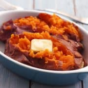 Toaster oven baked sweet potato with butter in a baking dish