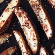 Crispy outside and creamy inside, these toaster oven baked potato wedges taste better than takeout and are so easy to customize. Potato Recipes | Toaster Oven | Potato Wedges