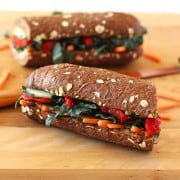 Roasted Red Pepper, Carrot and Hummus Sandwich. A not sad desk lunch bursting with flavor from sweet fire-roasted red peppers, creamy avocado, nutty hummus, bitter kale and crunchy veggies on a crusty loaf of whole grain bread.
