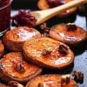 Roasted Sweet Potato Rounds are seasoned with coconut oil, salt and cinnamon then roasted to caramelized perfection. Drizzle with maple syrup, roasted cranberries and toasted pecans for an irresistible Thanksgiving snack or side dish for two.