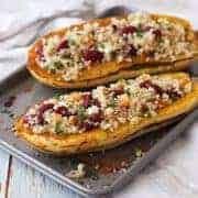 Filled delicata squash boats on a toaster oven baking sheet
