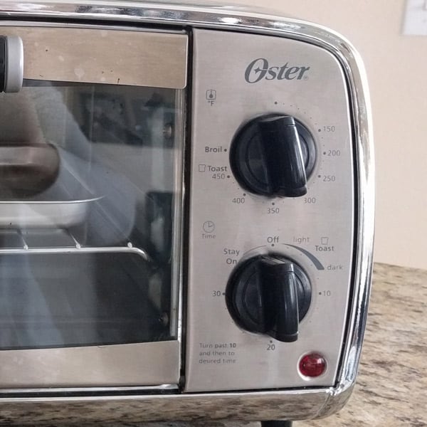 A shiny toaster oven with small and lighter colored markings will be difficult to read.